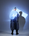 Model wearing ONGNA AABELI Pants styled with AABELI Shirt in Toronto streetwear look