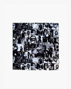 A black and white graphic print scarf with various images and text related to the theme of anarchy.
