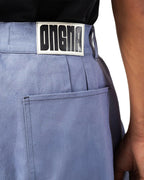 Blue jeans with a brand label on a white background